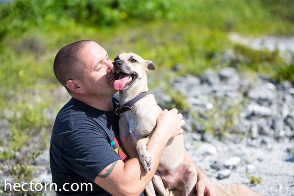 Man hugging his dog